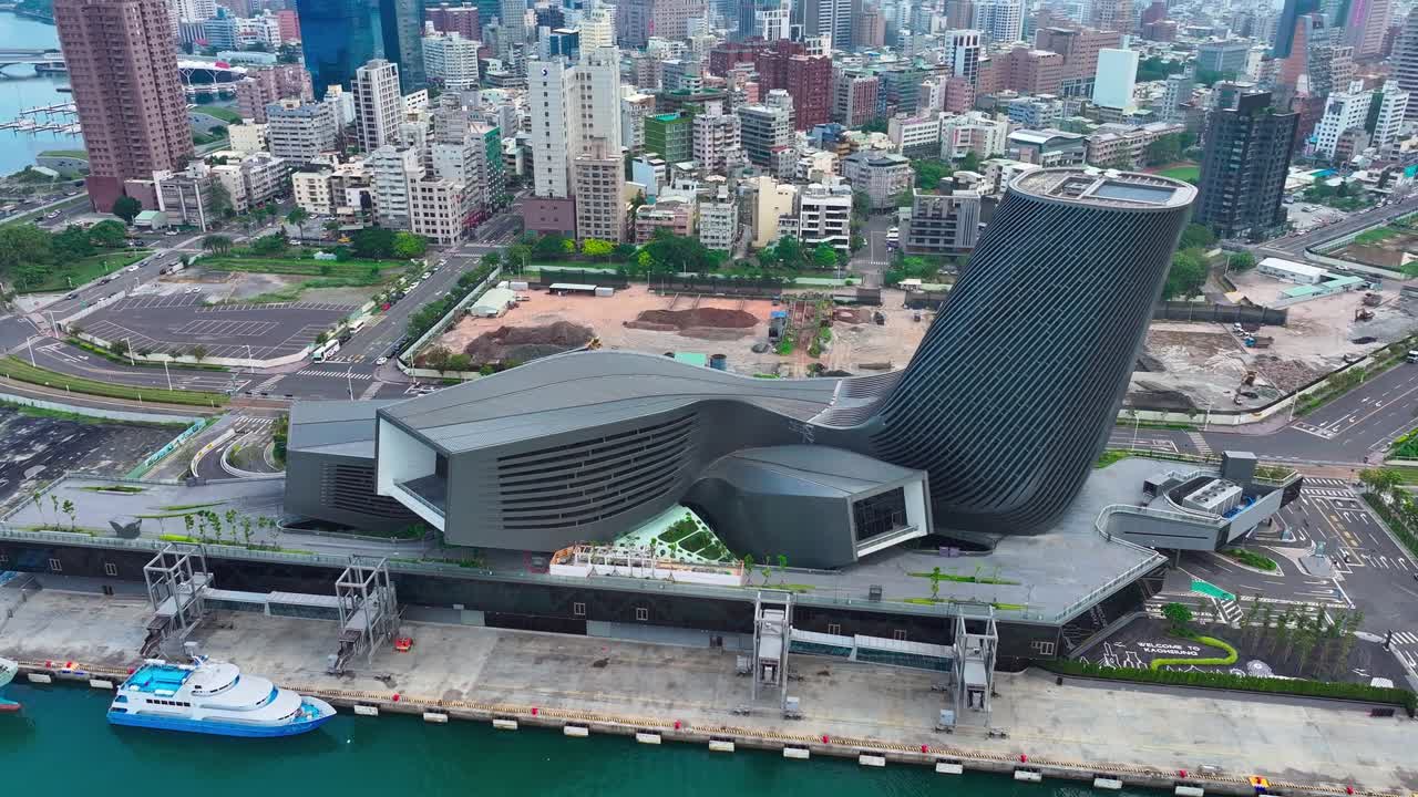 Aerial top down shot of Kaohsiung Cruise Terminal with Downtown skyline in Background