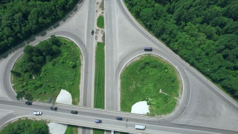 busy urban traffic. aerial top view traffic on circle road in city at day. 4k stock footage.