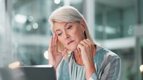 Stressed mature woman at work
