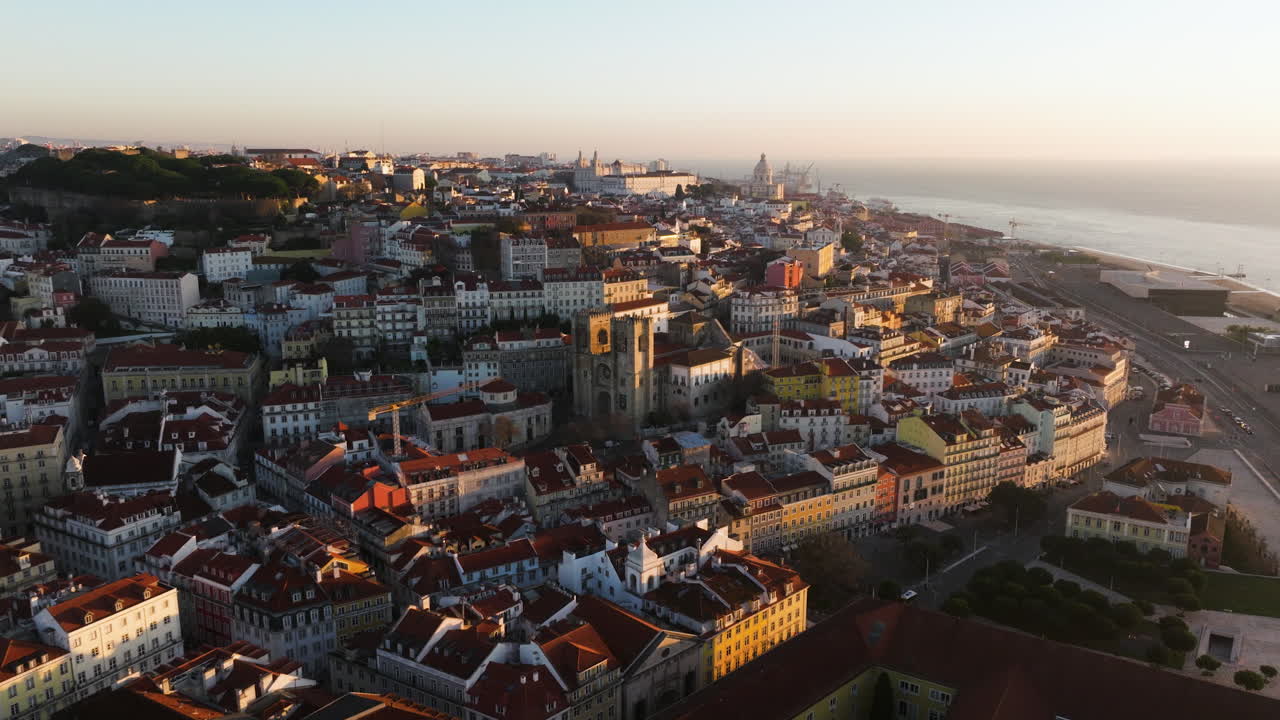 Lisbon aerial with light breaking over rooftops