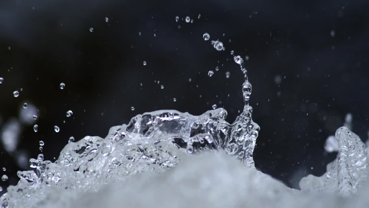 A close-up of turbulent river rapids in slow motion.