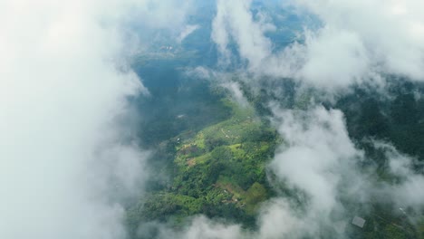 Mountainous-High-Altitude-Farming-and-Agricultural-Land,-Rain-Accumulating-Clouds-Water-Cycle,-Flying-through-Beautiful-Thick-Fluffy-Clouds