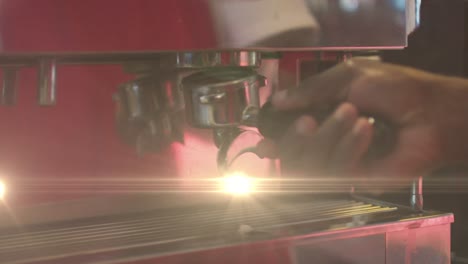 Animation-of-light-spots-over-biracial-man-preparing-coffee-in-cafe