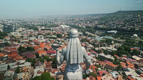 panoramic view of tbilisi, georgia, from behind the kartlis deda statue