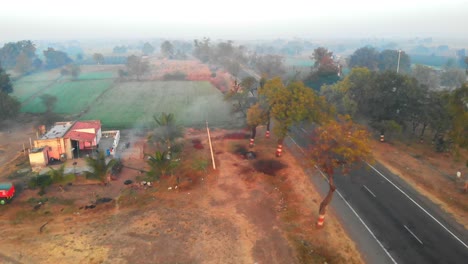 bird-eye-view-shot-of-national-highway-with-the-car-and-truck-passing-by