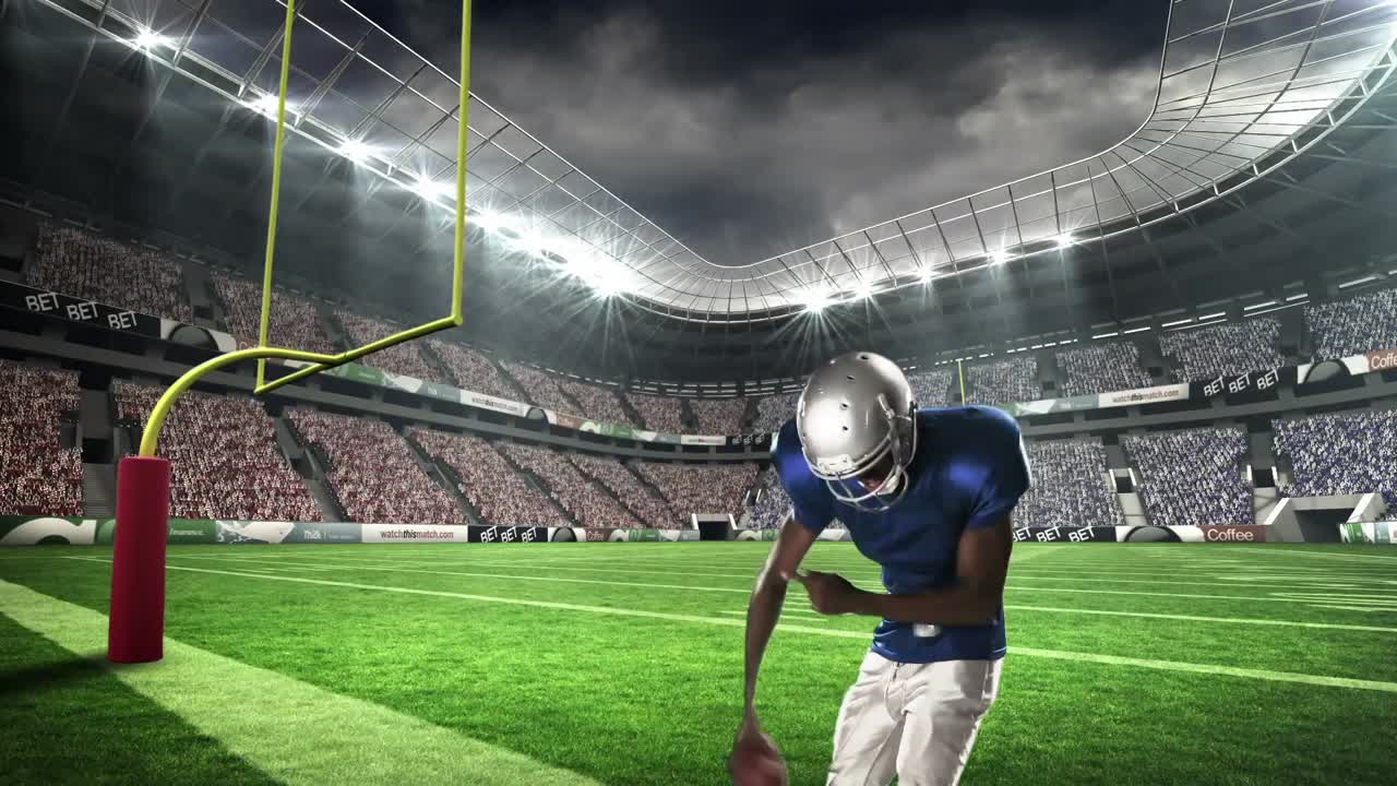 Giocatore di football americano che esulta con le braccia alzate