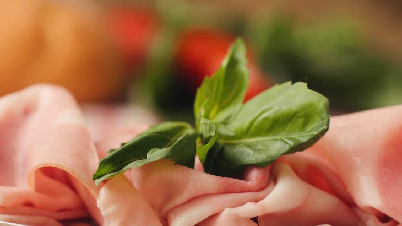 Ham italian mordatella, man Slices Of Traditional Italian antipasti mortadella sausage on a wooden cutting board, close up macro of chicken or turkey jamon, fat breakfast dish.