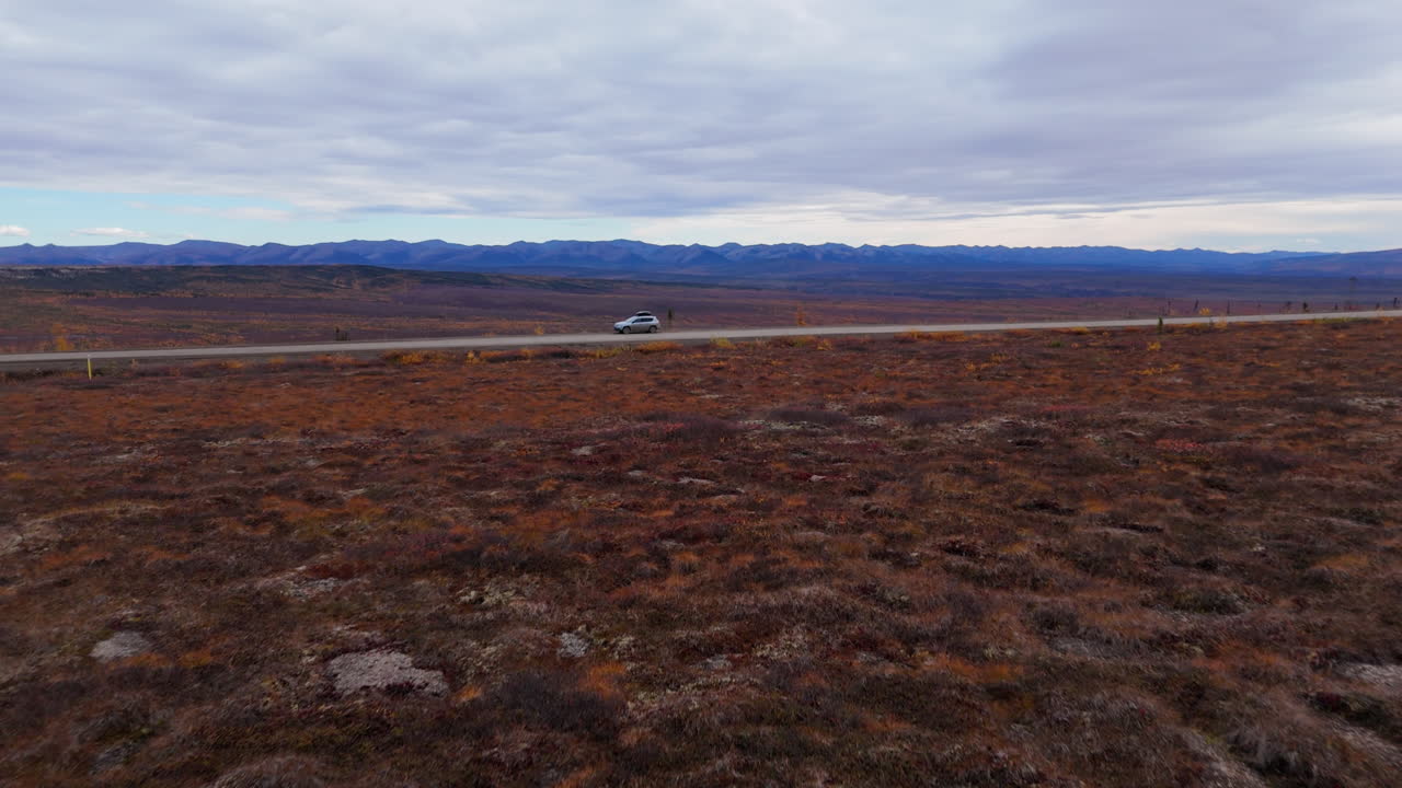 Fly Over Fall Colors Arctic Tundra Of Eagle Plains Through Dempster Highway In Yukon, Canada. Aerial Drone Shot