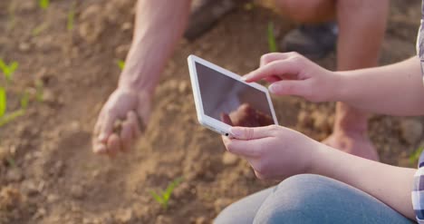 Scientists-Analyzing-Soil-At-Farm-1