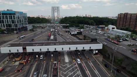 toll plaza, trucks and cars going through ez pass scanners