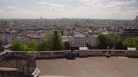 Paris-Panorama-View-From-Montmartre-Hill-with-birds-flying-by-4K-Wide-Shot