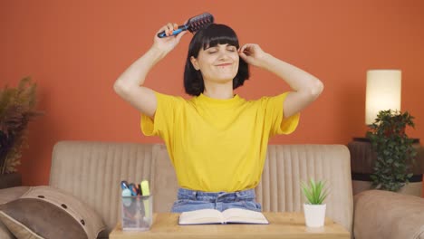 woman combing her hair.