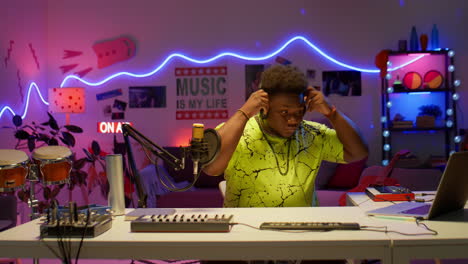 music producer preparing for work in audio studio
