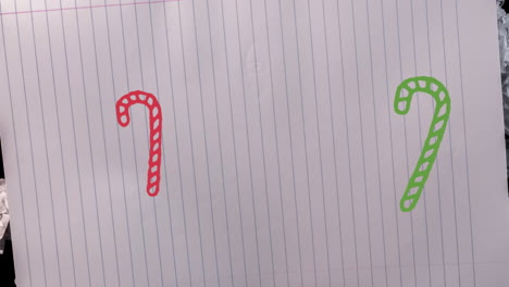 animación de dibujos a mano de decoraciones navideñas en fondo de papel blanco
