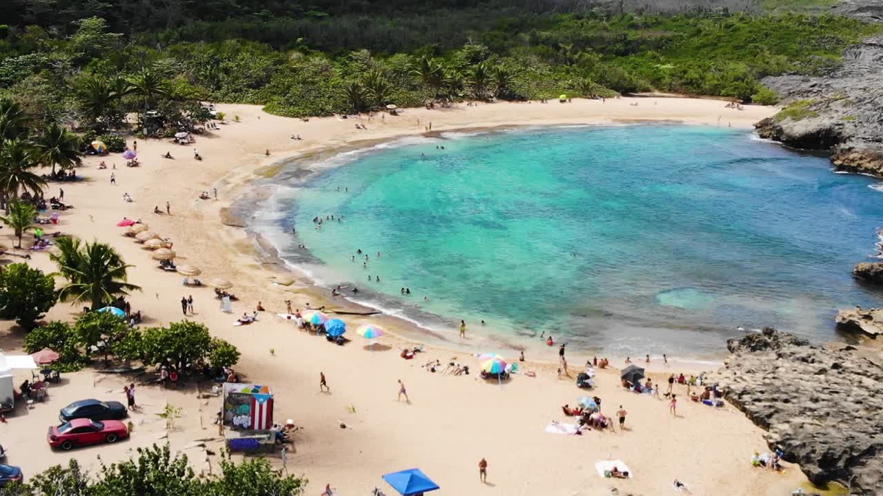 Aerial view in slow-motion of a small beach in Manati, Puerto Rico