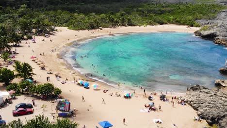aerial view in slow-motion of a small beach in manati, puerto rico