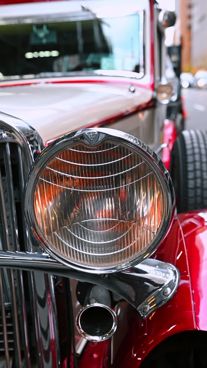 New York, USA, 8 October 2025: Vintage car headlight closeup. A closeup view of a shining headlight on a vintage Manhattan car