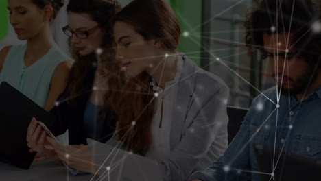 animation of network of connections over caucasian male and female coworkers in office