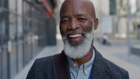 portrait happy senior african american businessman laughing in city enjoying professional urban lifestyle cheerful black man commuter slow motion