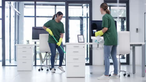 Happy-women-cleaning-an-office-together