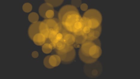 bokeh dorado de mosca y partículas en un fondo brillante