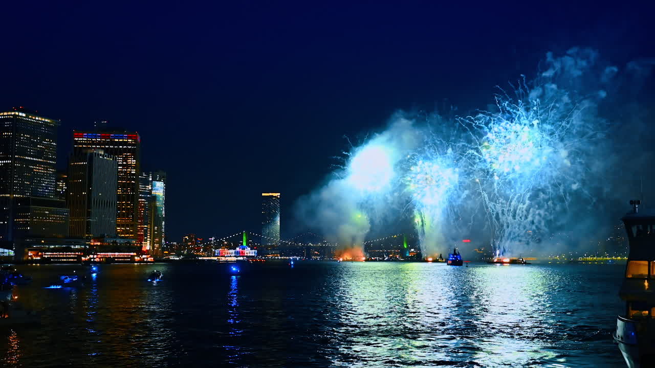Fireworks splashing over the East River in New York. Celebration in New York at night