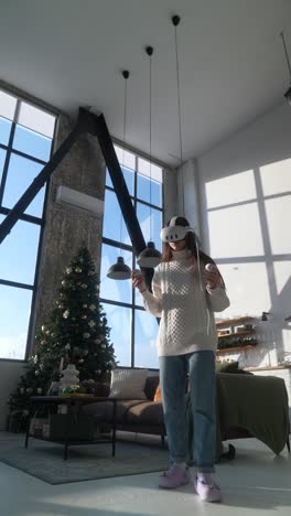 girl using vr headset in a decorated living room at christmas