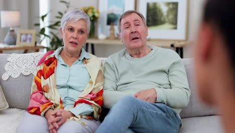 senior couple on couch, therapy with doctor