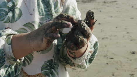 Little-child-is-curious-about-black-sand-modeling-Vacation-at-the-seaside