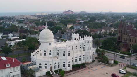 Drone-view-of-Sacred-Heart-Catholic-Church-and-surrounding-area-in-Galveston,-Texas