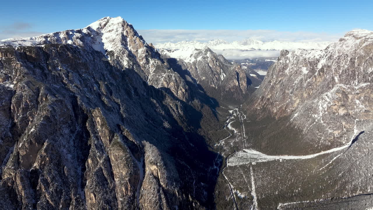 Aerial drone view of snow on the mountains in the Dolomites, Italy