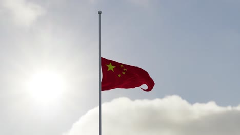 flag of china half mast in the wind