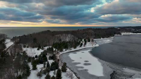 Descending-over-a-frozen-lake-at-sunset