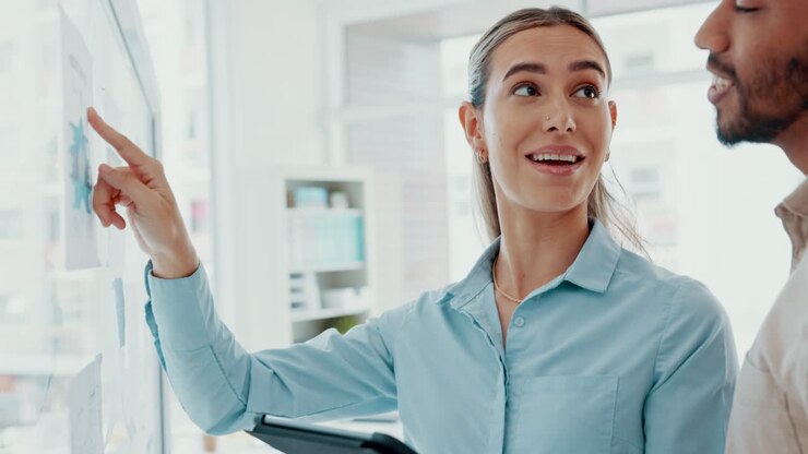 Woman and man brainstorming in a meeting