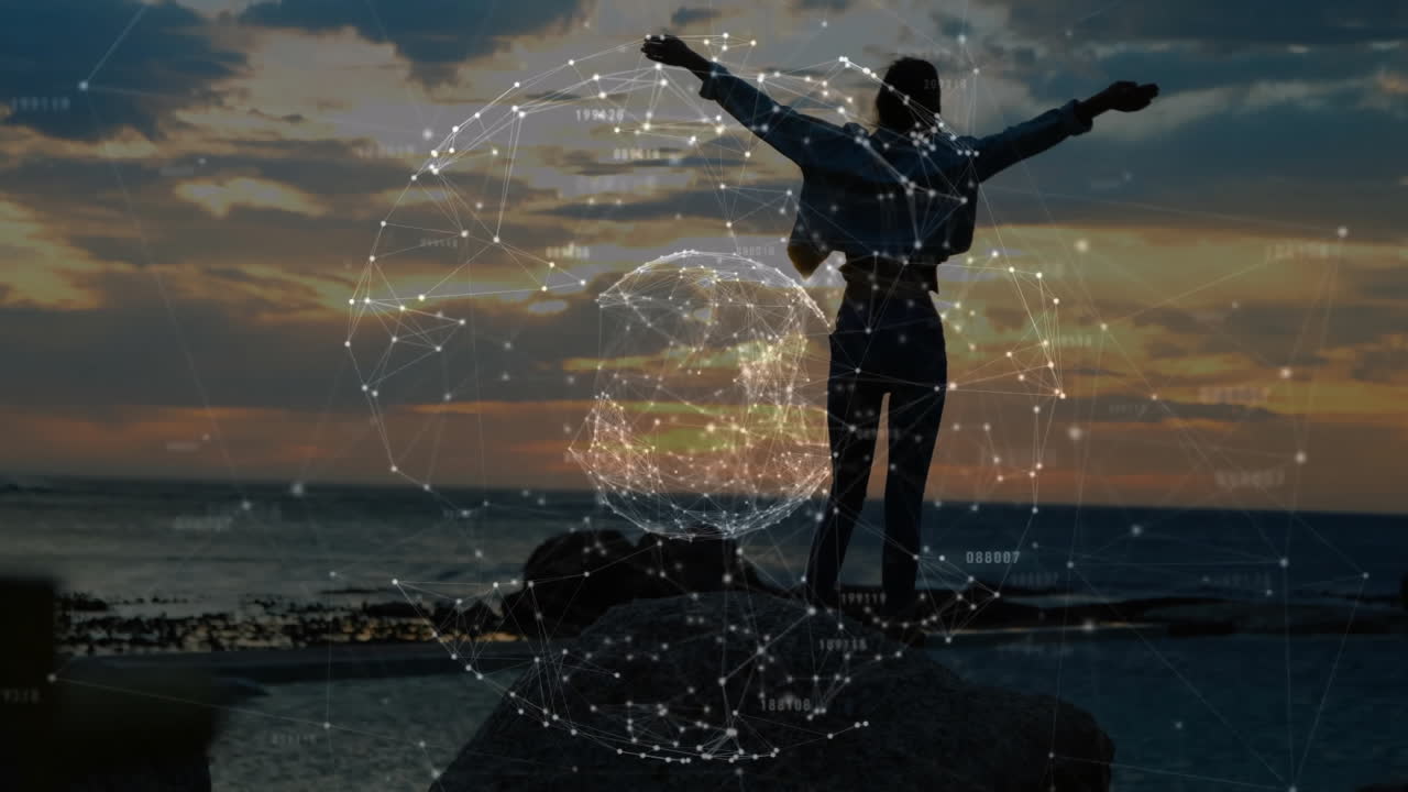 Woman standing on coastal rock at sunset, displaying technology network sphere overlays