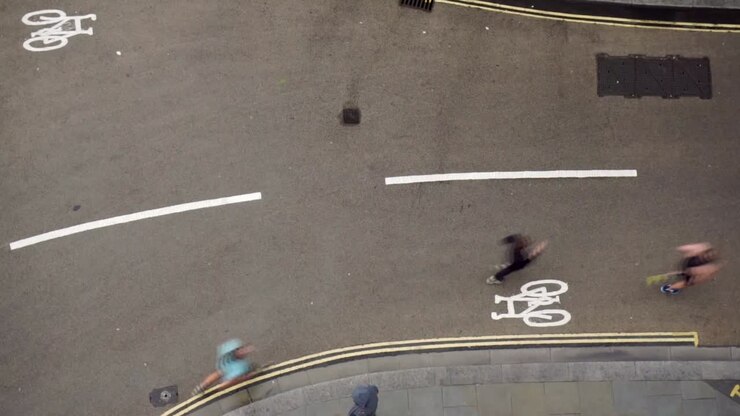 Sped up timelapse birds eye view of runners on street
