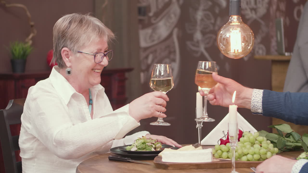 People enjoying wine and food at a restaurant