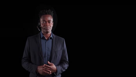 african american businessman talking on black background