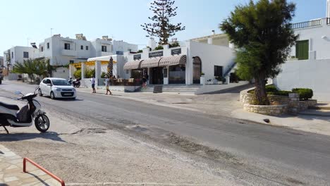 static shot of customers walking in and out of a bakery in naxos, greece