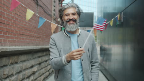 man celebrating in an urban setting with an american flag