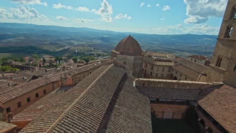 fast aerial over the walled town of volterra, province of pisa, italy