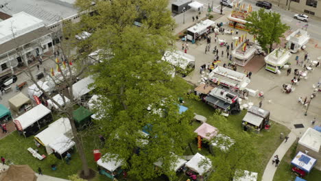 aerial - dogwood festival people and booths, siloam springs, ar, truck left