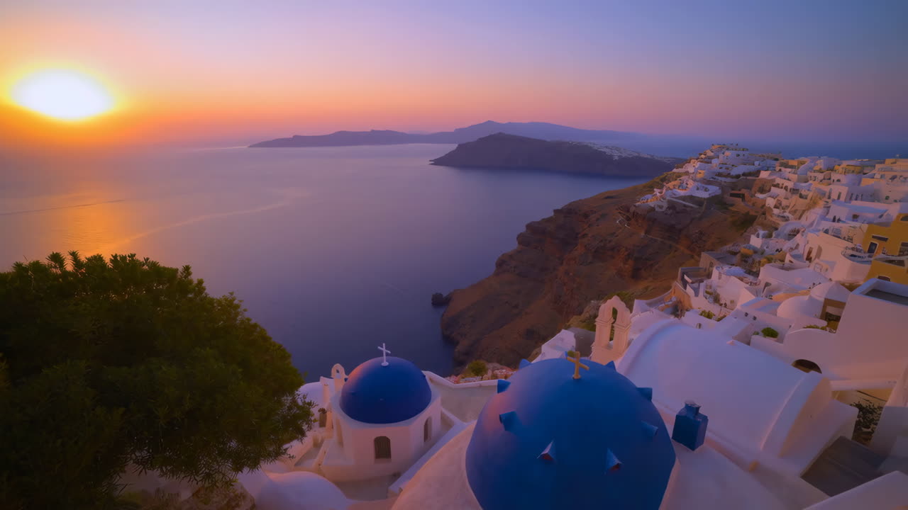 Panoramic Sunset View of Oia, Santorini with Blue Domes