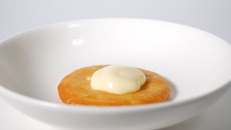 round crackers with mayonnaise