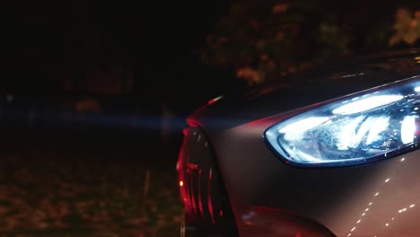 beam of light from xenon headlight of car, dark evening environment, czechia
