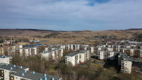 flying with drone over village area in hungary, ozd city