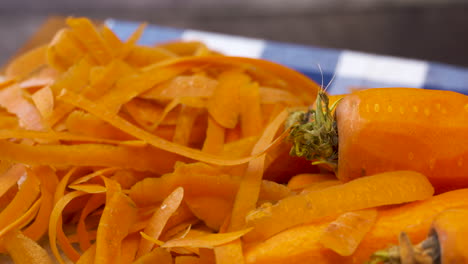 A-bunch-of-freshly-peeled,-bright,-orange-carrots