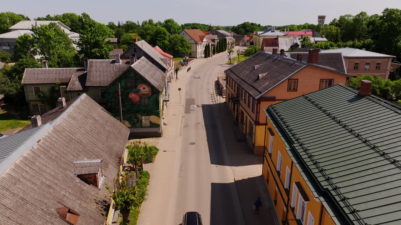 Colorful street in Aizpute town captured from drone on sunny summer day