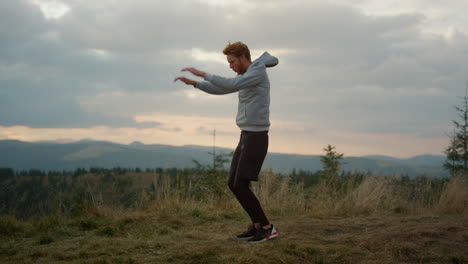 young runner jumping on place . male jogger warming before cardio workout