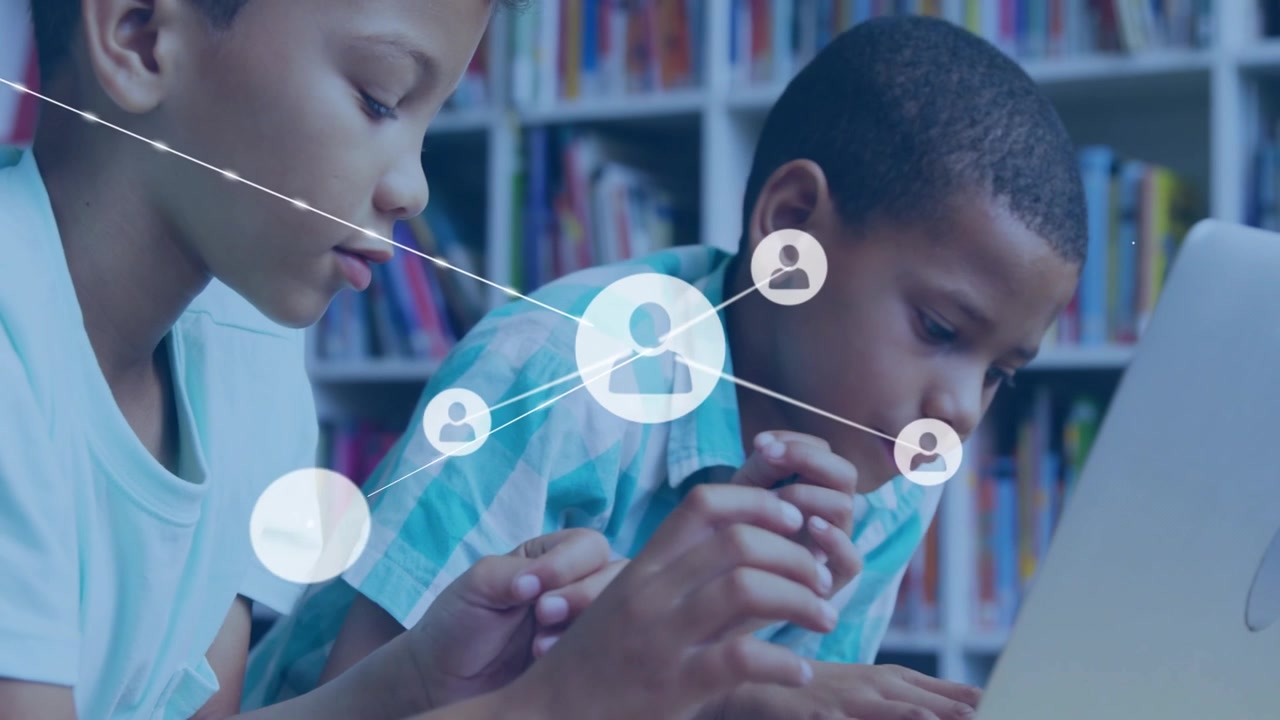 Young Boys Using Laptop with Digital Network Overlay